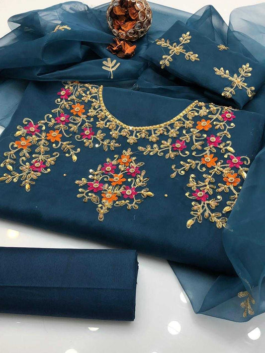 Navy blue fabric with gold and multicolor embroidery on a white background