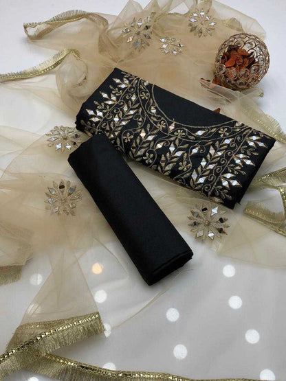 Black clutch bag with gold embroidery on a white background with decorative ribbons and snowflakes.