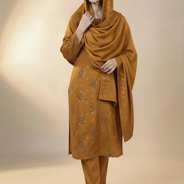 Mustard yellow traditional outfit with a shawl on a neutral background