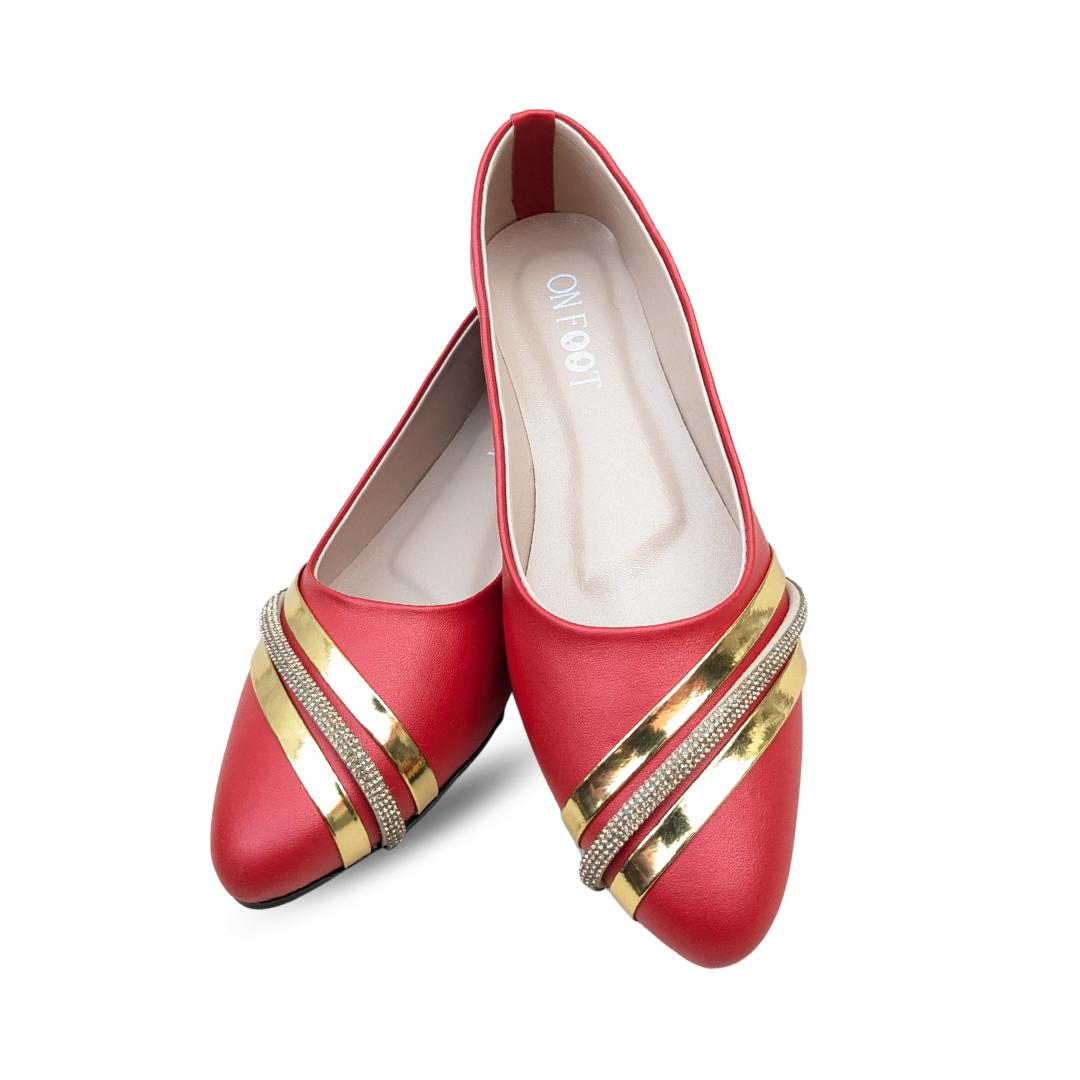 Red shoes with gold accents on a white background