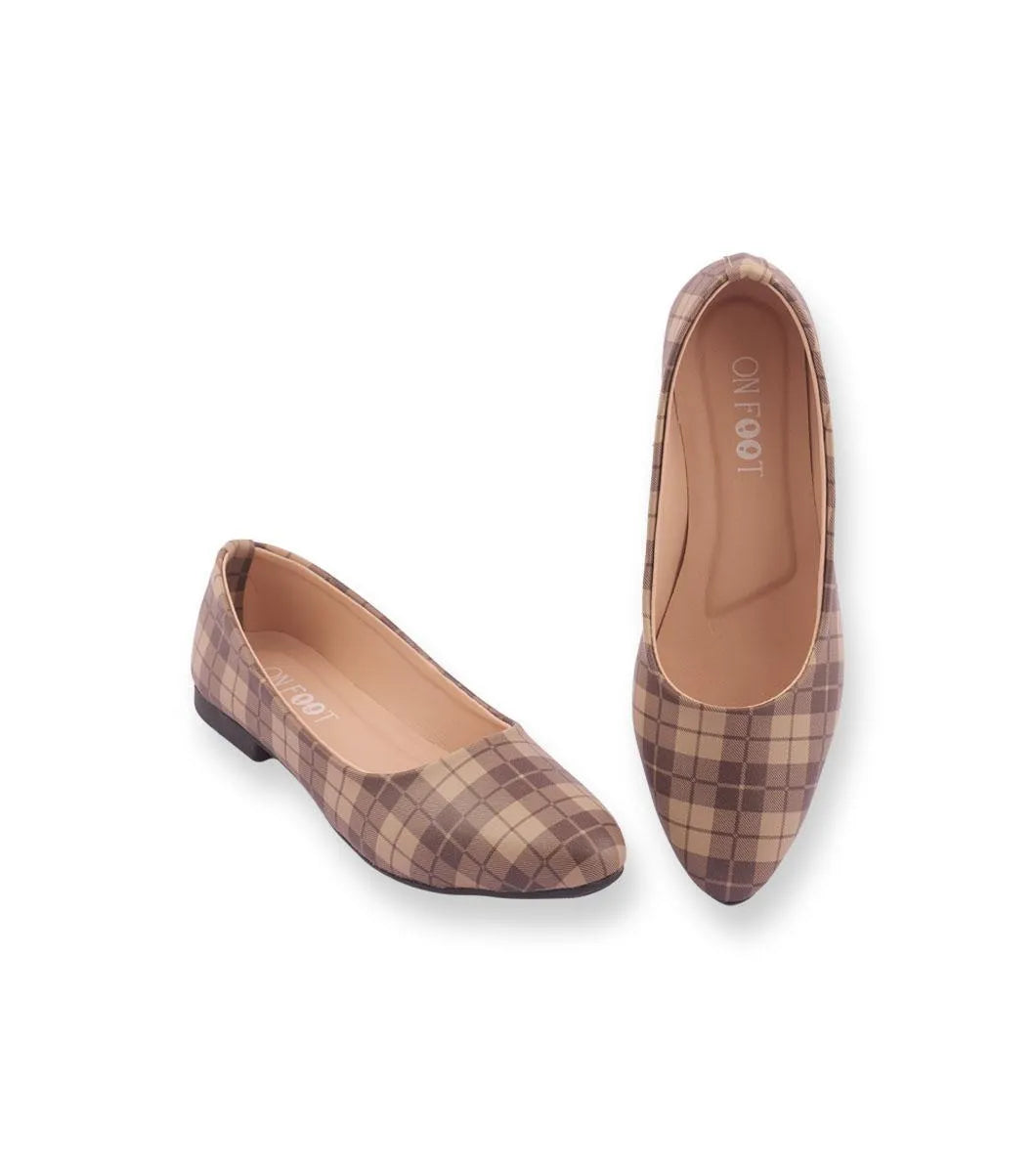 Pair of checkered flat shoes on a white background