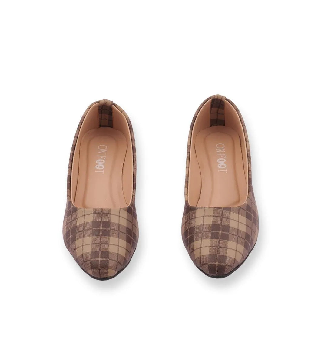 Pair of brown plaid shoes on a white background