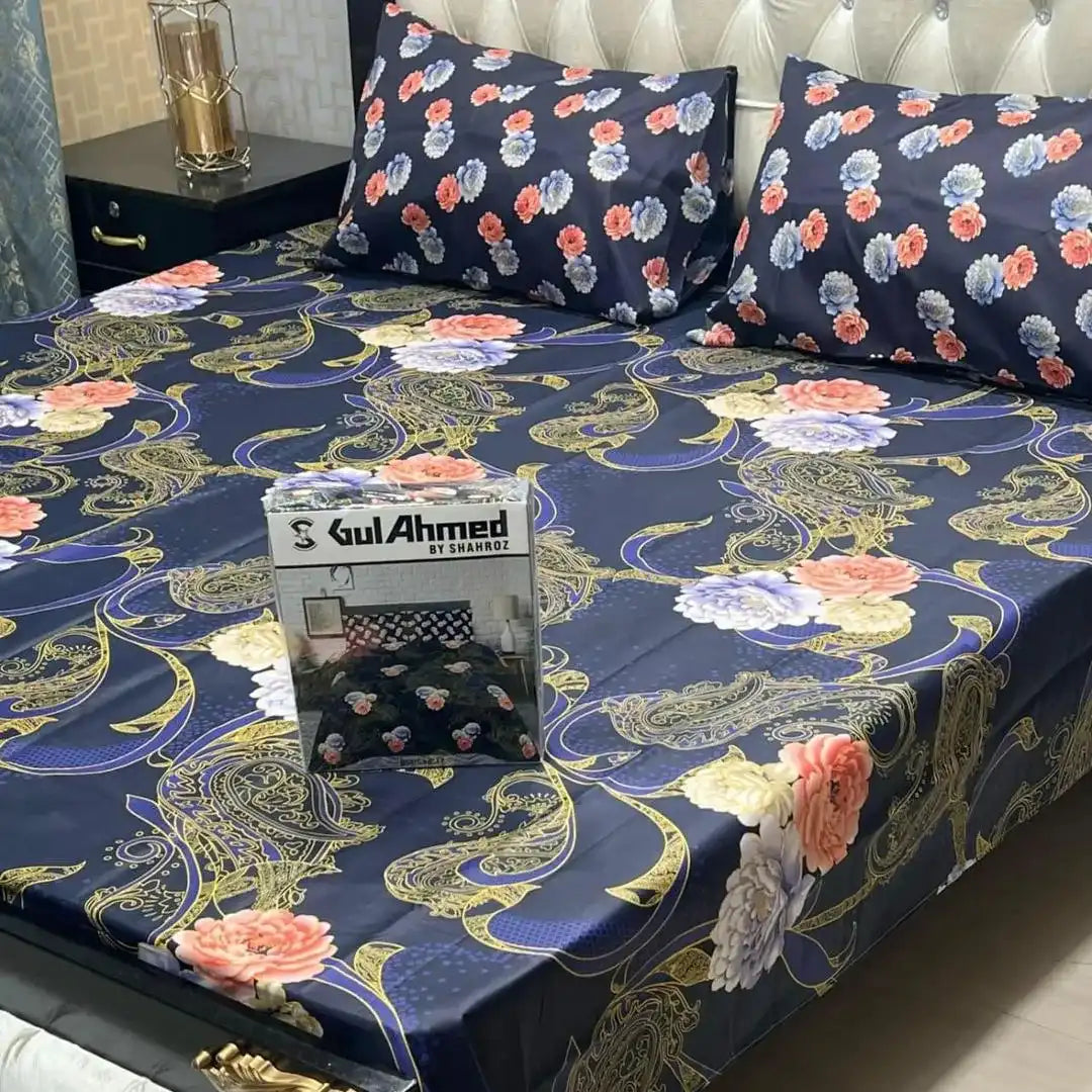 Floral patterned bedspread on a bed with a Gul Ahmed box.