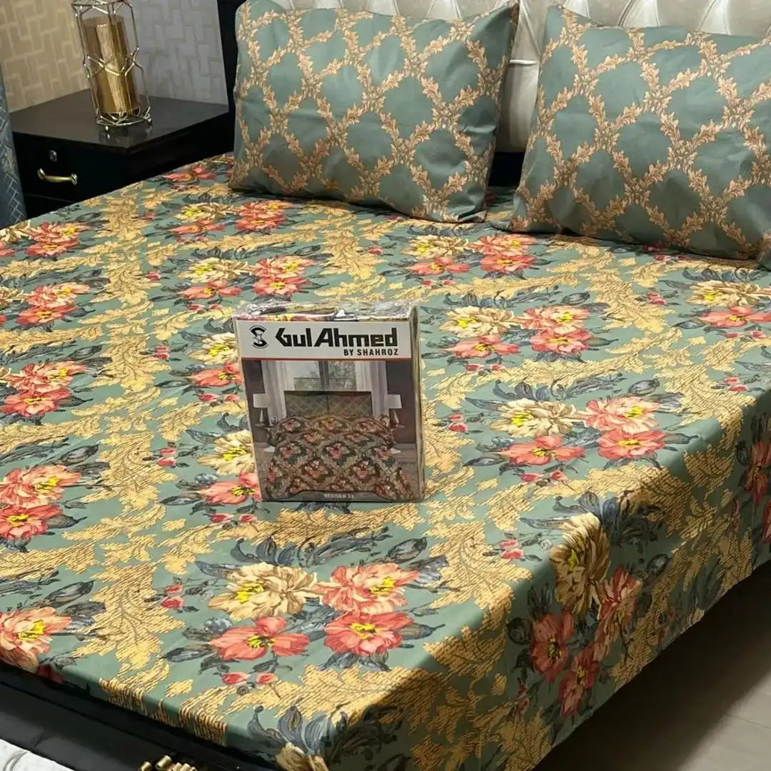 Floral patterned bedspread on a bed with a 'Gul Ahmed' box in the center.