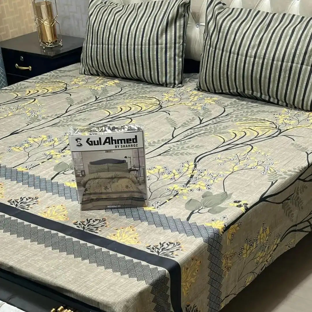 Furniture cover with floral pattern and 'Gul Ahmed' branding on a sofa.