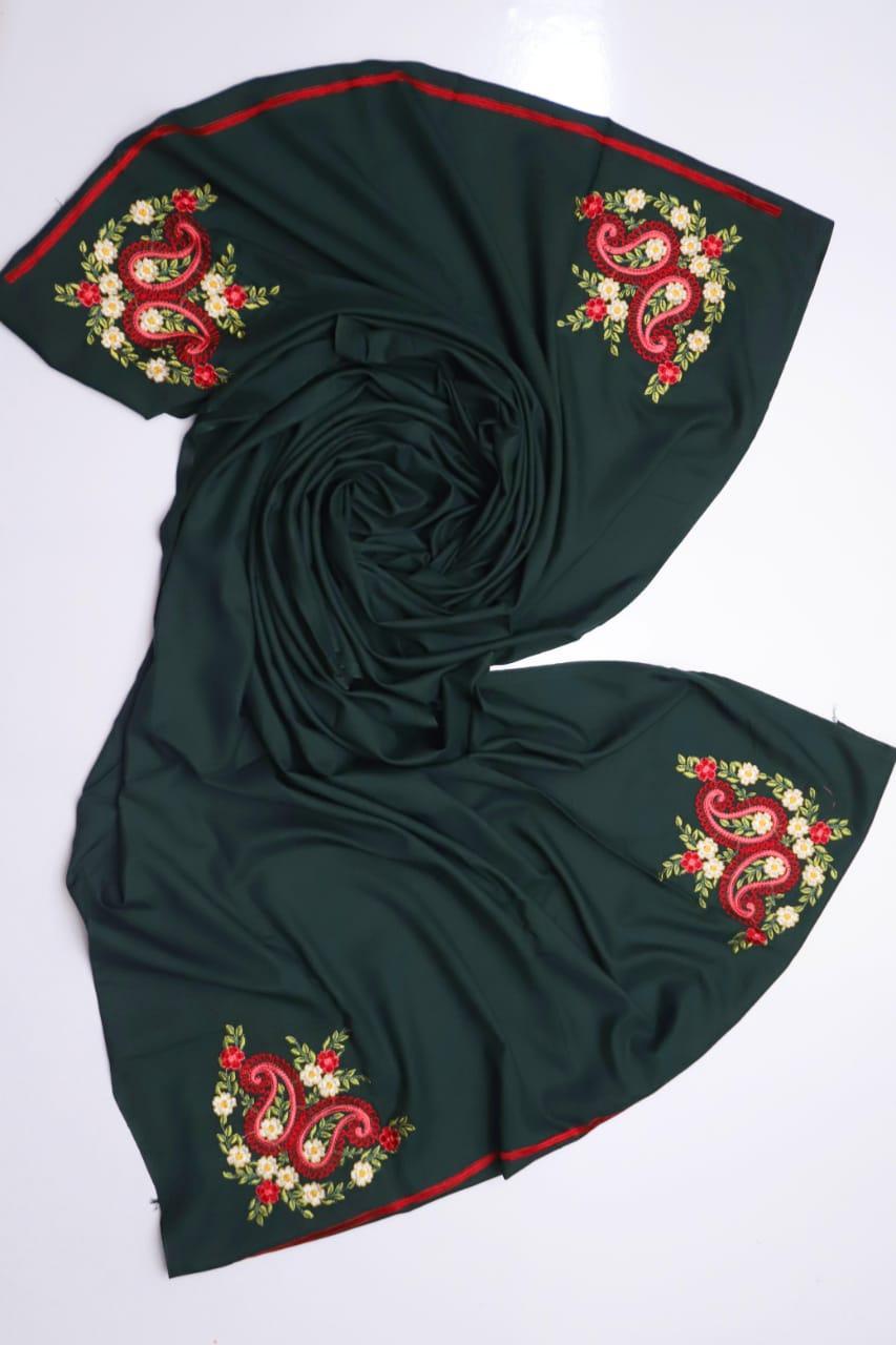 Dark green scarf with red and gold embroidery on a white background