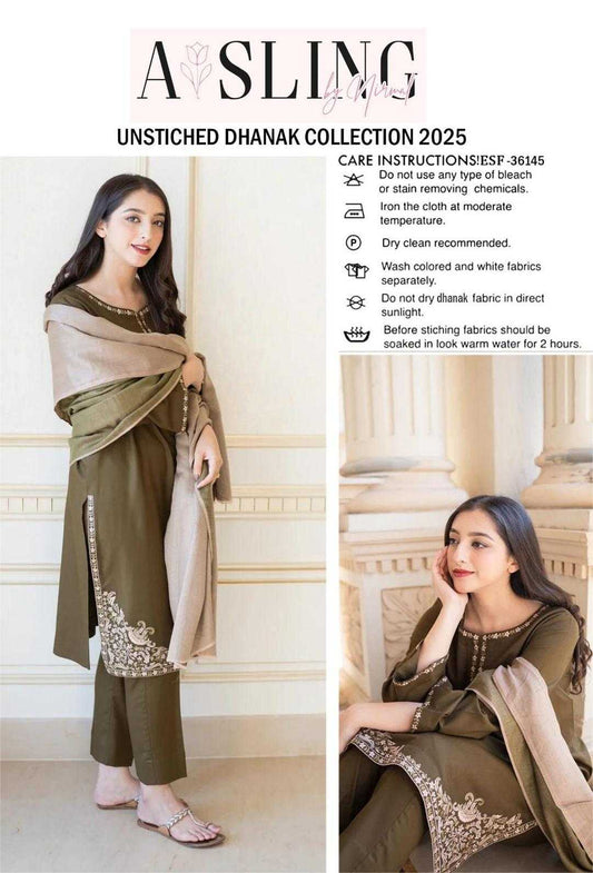 Woman wearing a green and beige traditional outfit with a sling, against a white wall.