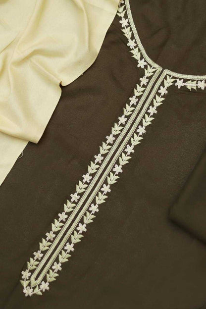 Brown fabric with white floral embroidery on a plain background