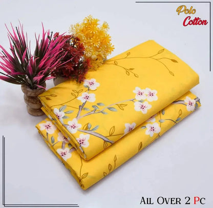 Two yellow fabrics with floral patterns on a white background, branded 'Polo Cotton'.