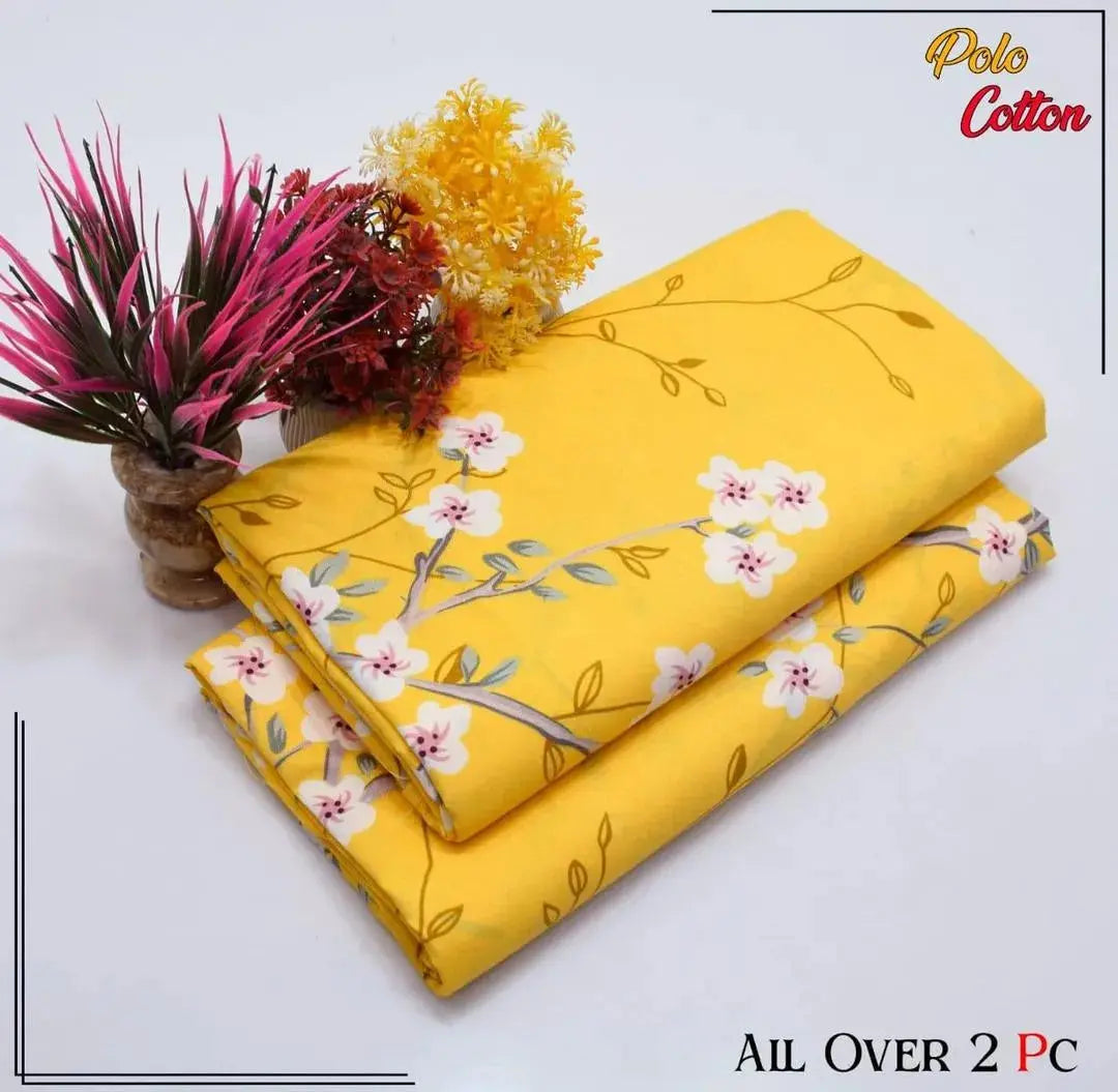 Two yellow fabric sheets with floral patterns on a white background, featuring the brand 'Polo Cotton'.