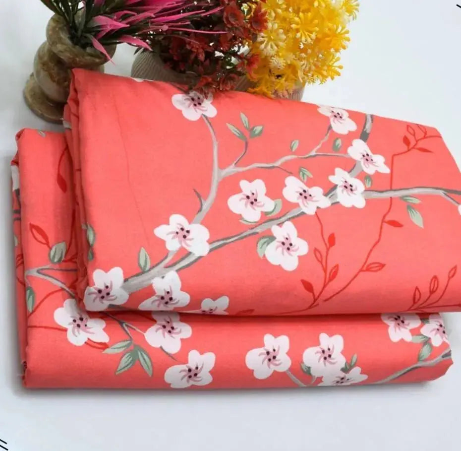 Red fabric with white floral patterns on a white background