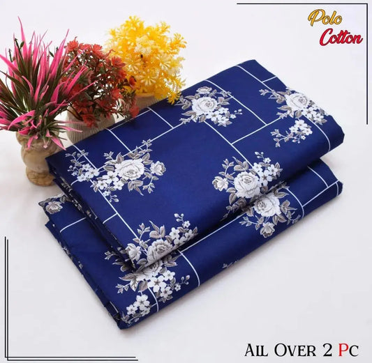 Roll of blue fabric with white floral pattern on a white background, featuring Polo Cotton branding.