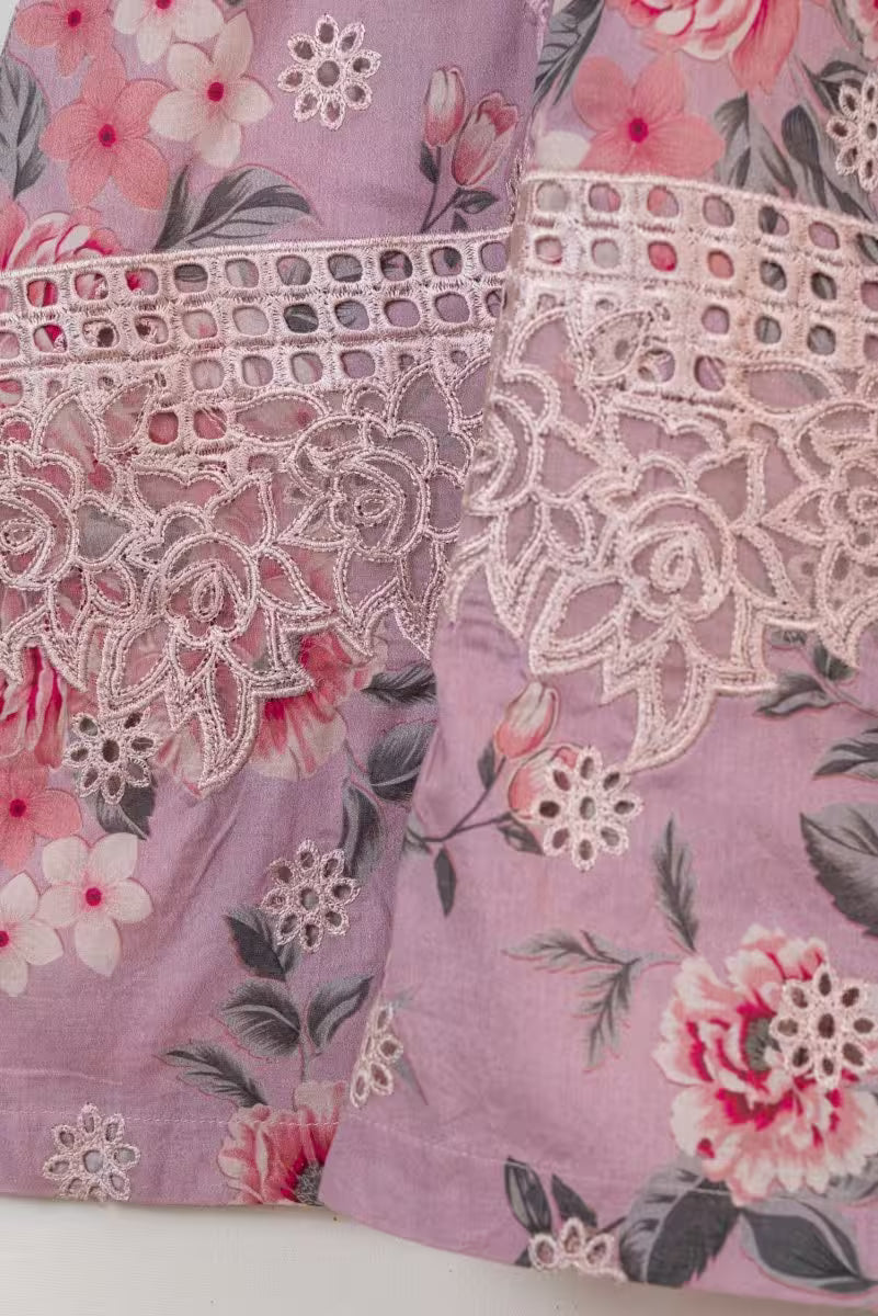 Floral fabric with lace trim on a white background